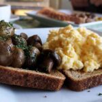 Scrambled eggs and mushrooms on toast